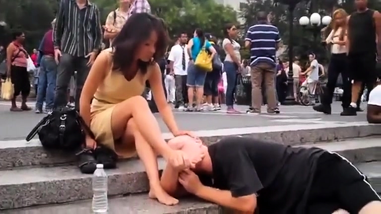 768px x 432px - Gorgeous Brunette Babe Has A Guy Licking Her Feet In Public Video at Porn  Lib